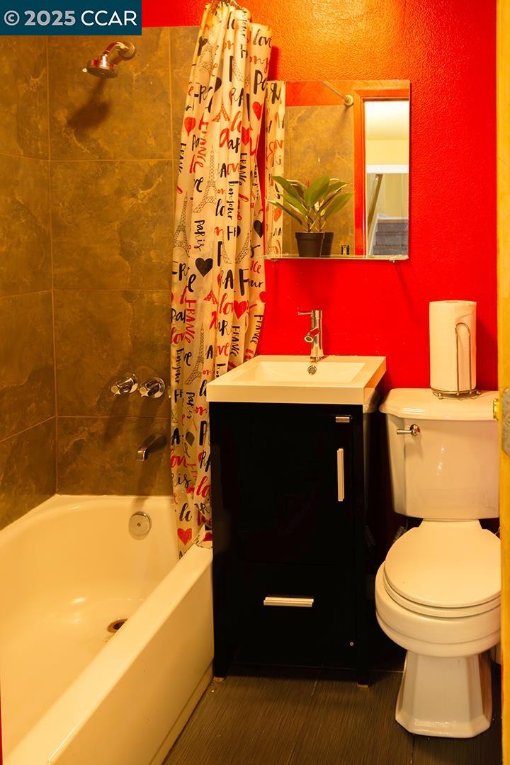 Melrose Heights Oakland, CA 94621 - Photo 34 of 34 a bathroom with a sink toilet and shower