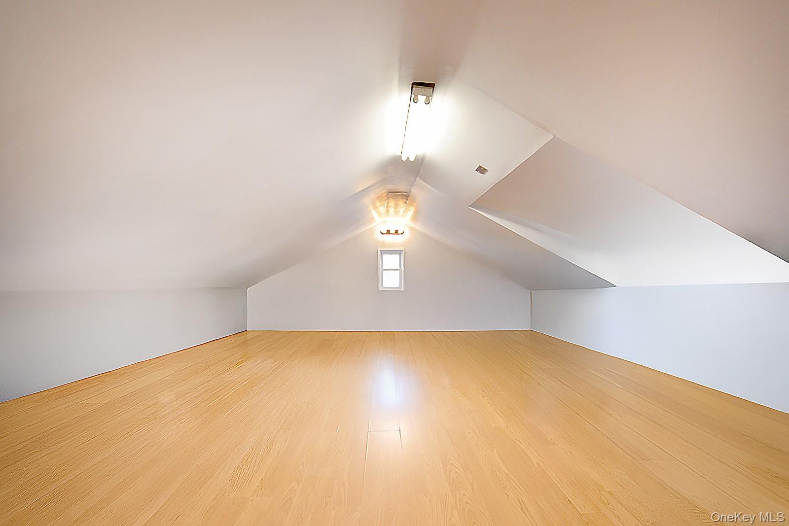 92-49 Springfield Boulevard Queens, NY 11428 - Photo 13 of 17 a view of a room with a chandelier fan