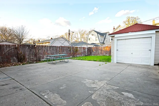 a view of backyard with a garden and entertaining space