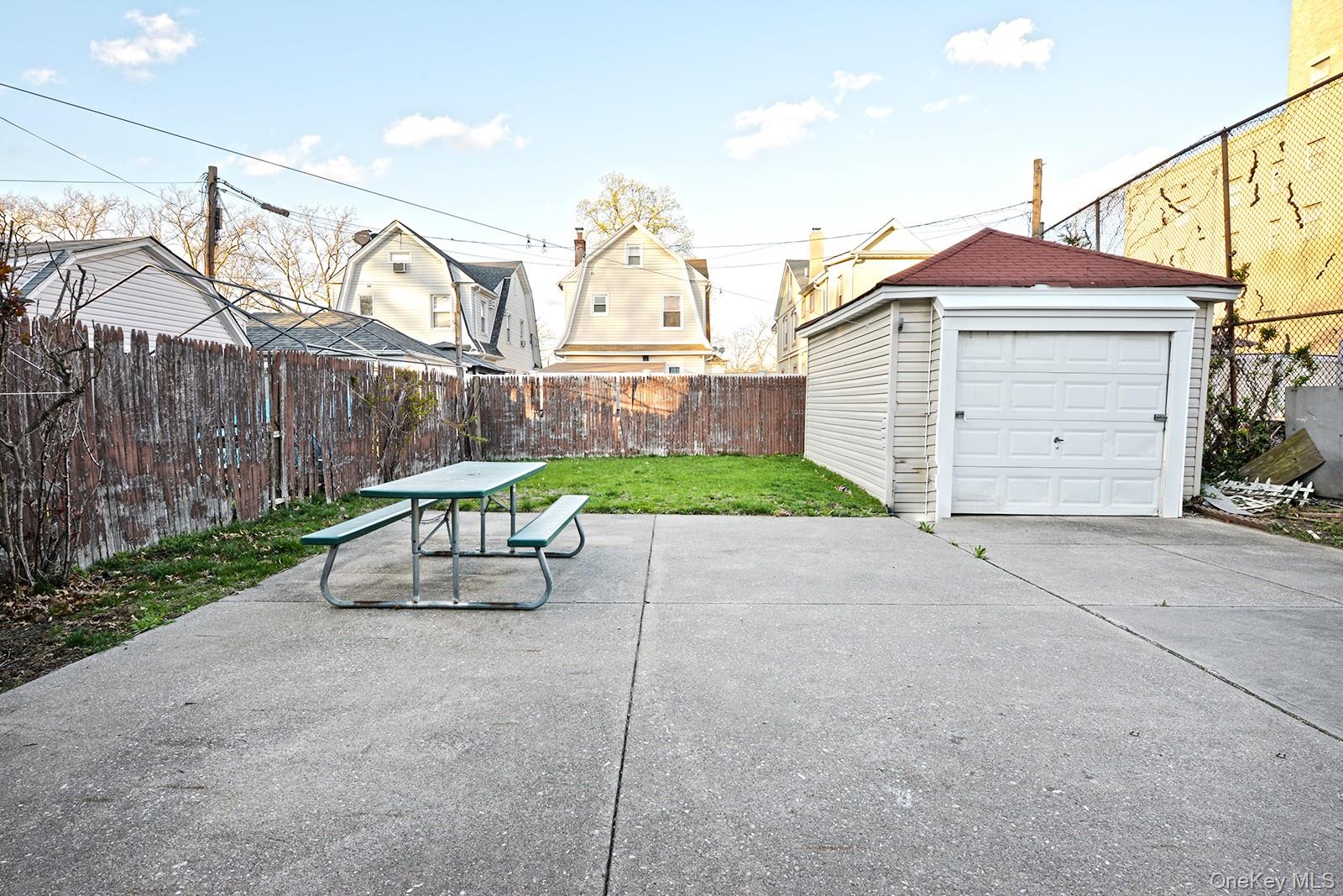 92-49 Springfield Boulevard Queens, NY 11428 - Photo 16 of 17 a view of backyard with a garden and entertaining space