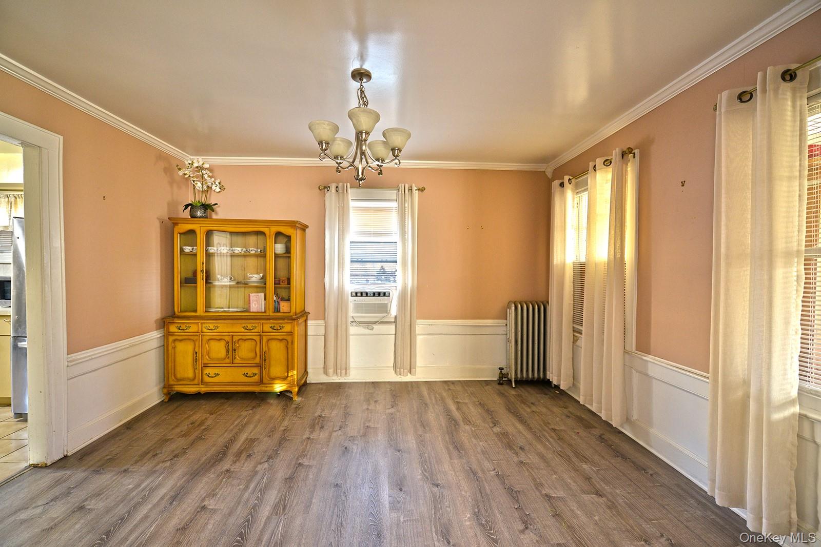92-49 Springfield Boulevard Queens, NY 11428 - Photo 6 of 17 a view of a room with wooden floor and window