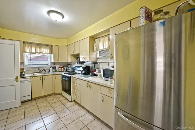 a kitchen with a refrigerator a sink and dishwasher