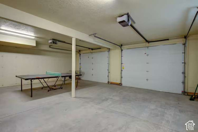 1735 West Pinyon Hls Road Hatch, UT 84735 - Photo 18 of 21 Two-car garage with concrete flooring, two overhead garage doors, and two garage door openers