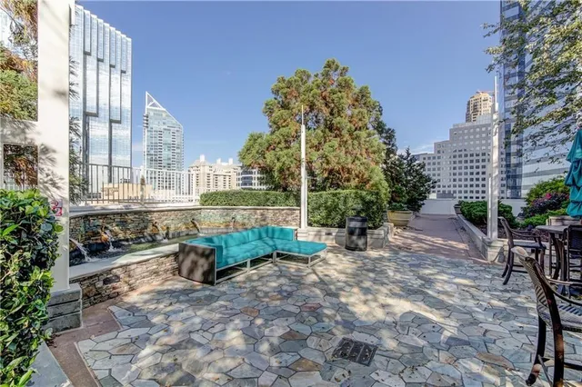 a view of a backyard with sitting area