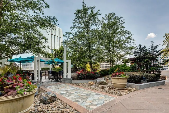 a view of a patio with chair and tables