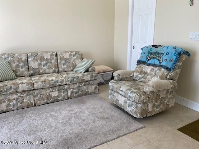 2120 Orbiter Court, Unit 166 Titusville, FL 32796 - Photo 25 of 46 a living room with furniture and a couch