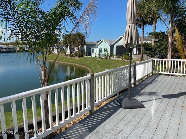 2120 Orbiter Court, Unit 166 Titusville, FL 32796 - Photo 8 of 46 a view of a wooden deck and a yard with lake view