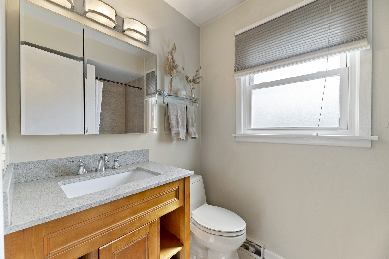 31 Mulberry E Road Deerfield, IL 60015 - Photo 20 of 32 a bathroom with a granite countertop sink toilet and mirror
