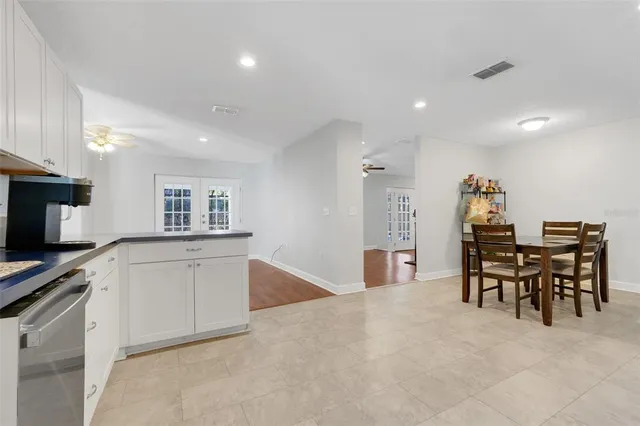a kitchen with a table and chairs in it