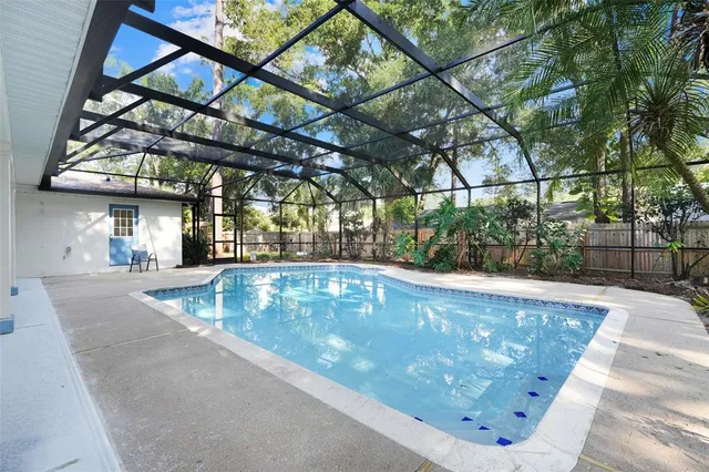 a view of a swimming pool with a patio