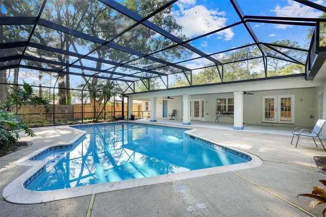 a view of swimming pool with a patio