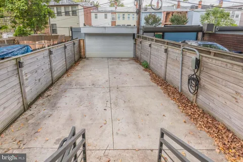 a view of a backyard with sitting area