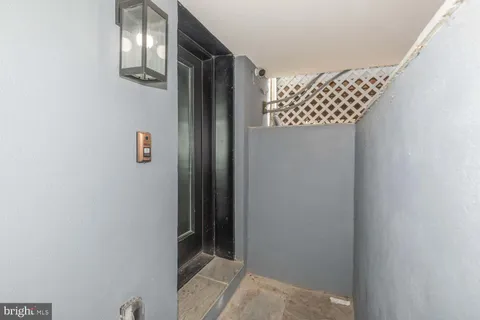 a bathroom with a shower and a sink