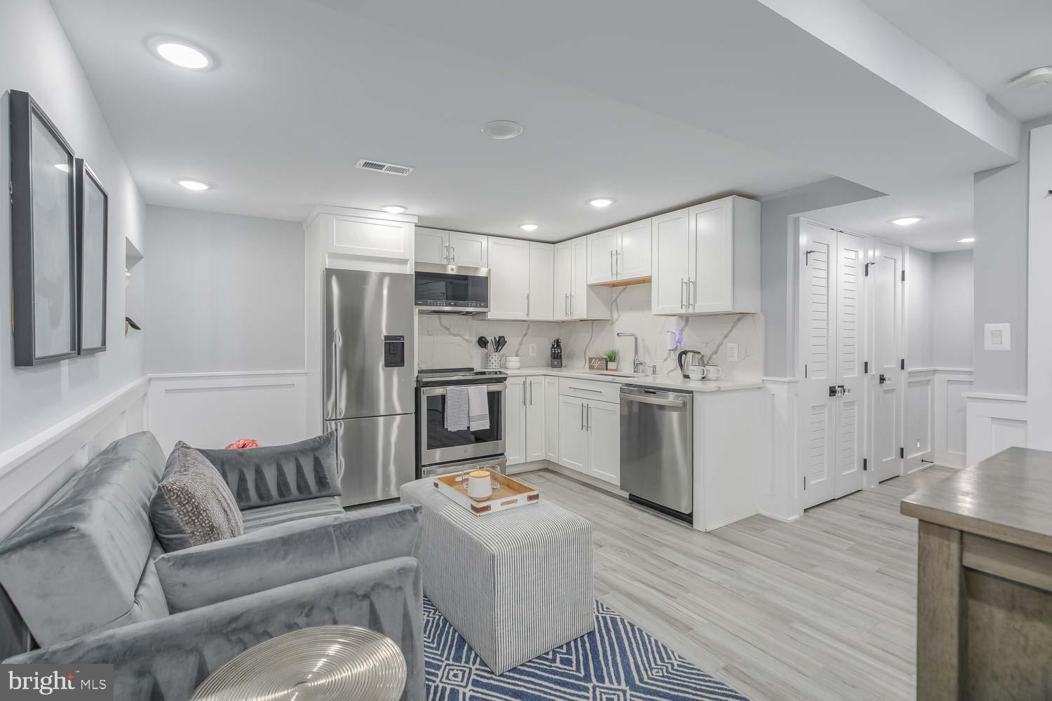 1427 Perry Place Northwest Washington, DC 20010 - Photo 34 of 40 a living room with furniture and kitchen view