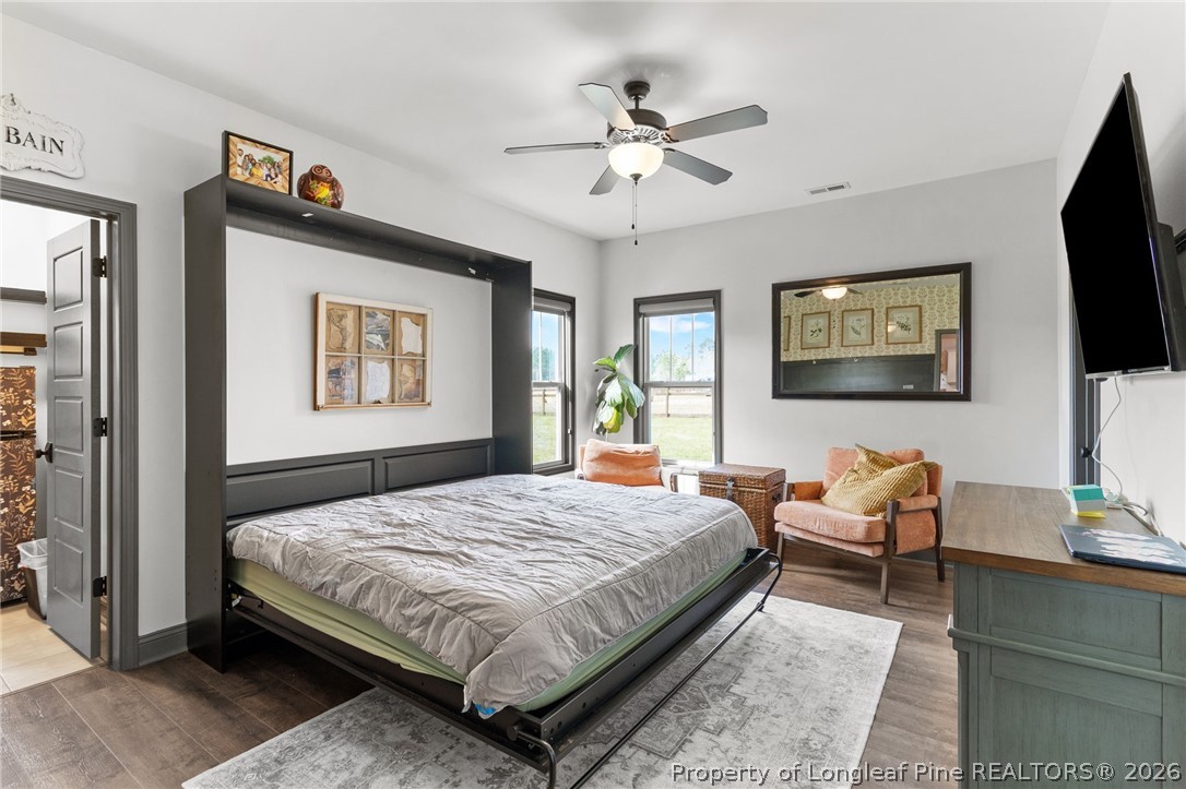 5535 Butler Nursery Road Fayetteville, NC 28306 - Photo 21 of 50 a bedroom with a bed and a flat screen tv