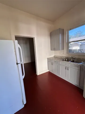 a view of a kitchen with a sink and dishwasher
