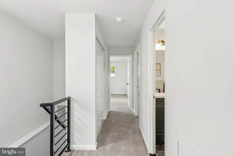 a view of a livingroom with walk in closet and bedroom