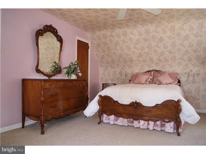 1101 East Darby Road Havertown, PA 19083 - Photo 13 of 20 a bedroom with a bed window and couch