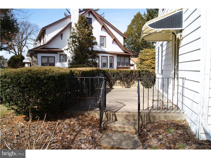 1101 East Darby Road Havertown, PA 19083 - Photo 4 of 20 a front view of a house with a yard