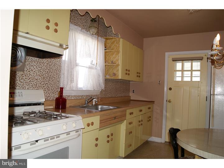 1101 East Darby Road Havertown, PA 19083 - Photo 9 of 20 a kitchen with cabinets appliances and a window