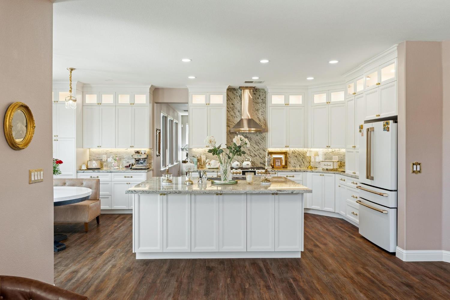 426 South Highland Avenue Ripon, CA 95366 - Photo 16 of 82 a kitchen with white cabinets and stainless steel appliances