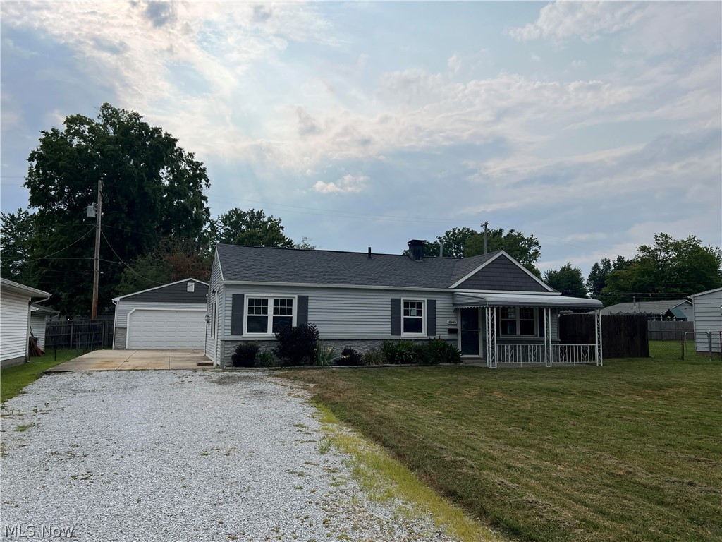 4940 Wake Robin Road Mentor, OH 44060 - Photo 1 of 9 Single story home featuring a garage, a front lawn, and an outbuilding