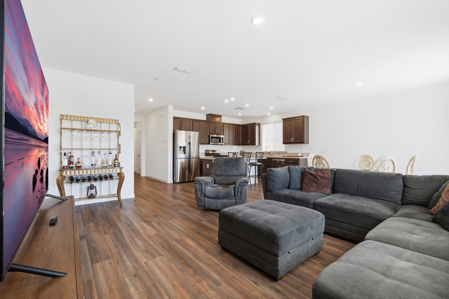 5713 Natalie Way Keyes, CA 95328 - Photo 8 of 30 a living room with furniture wooden floor and a flat screen tv
