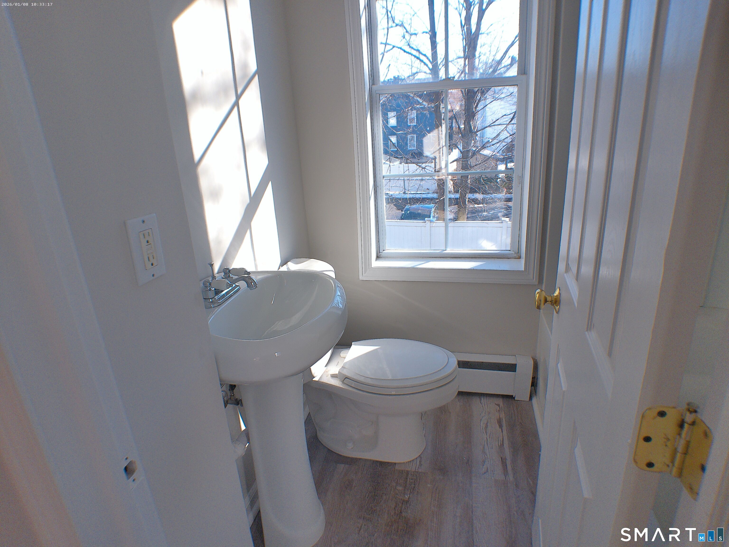 85 North Colony Street Wallingford, CT 06492 - Photo 12 of 35 a white toilet sitting next to a window in a bathroom