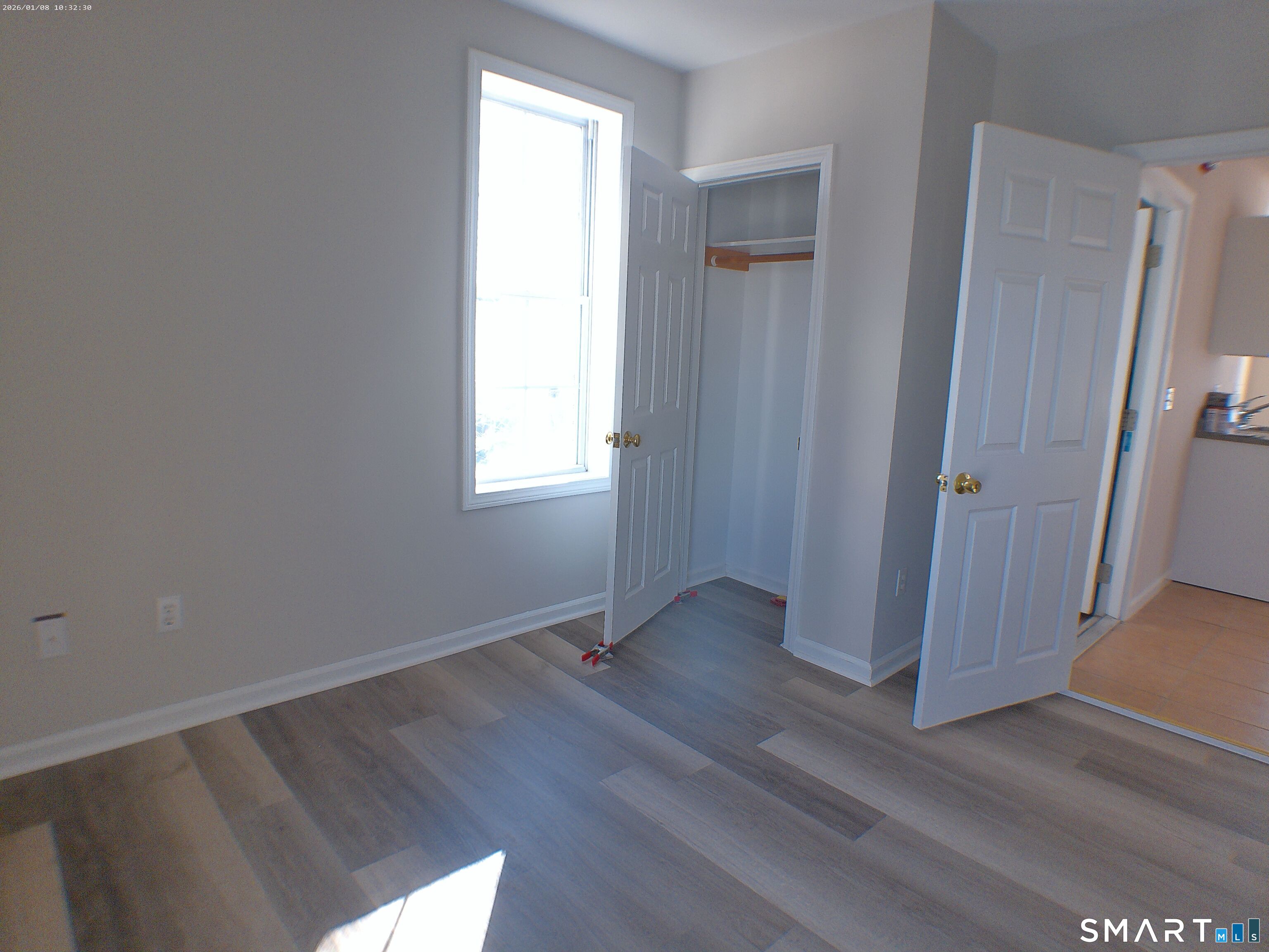 85 North Colony Street Wallingford, CT 06492 - Photo 13 of 35 an empty room with wooden floor and window