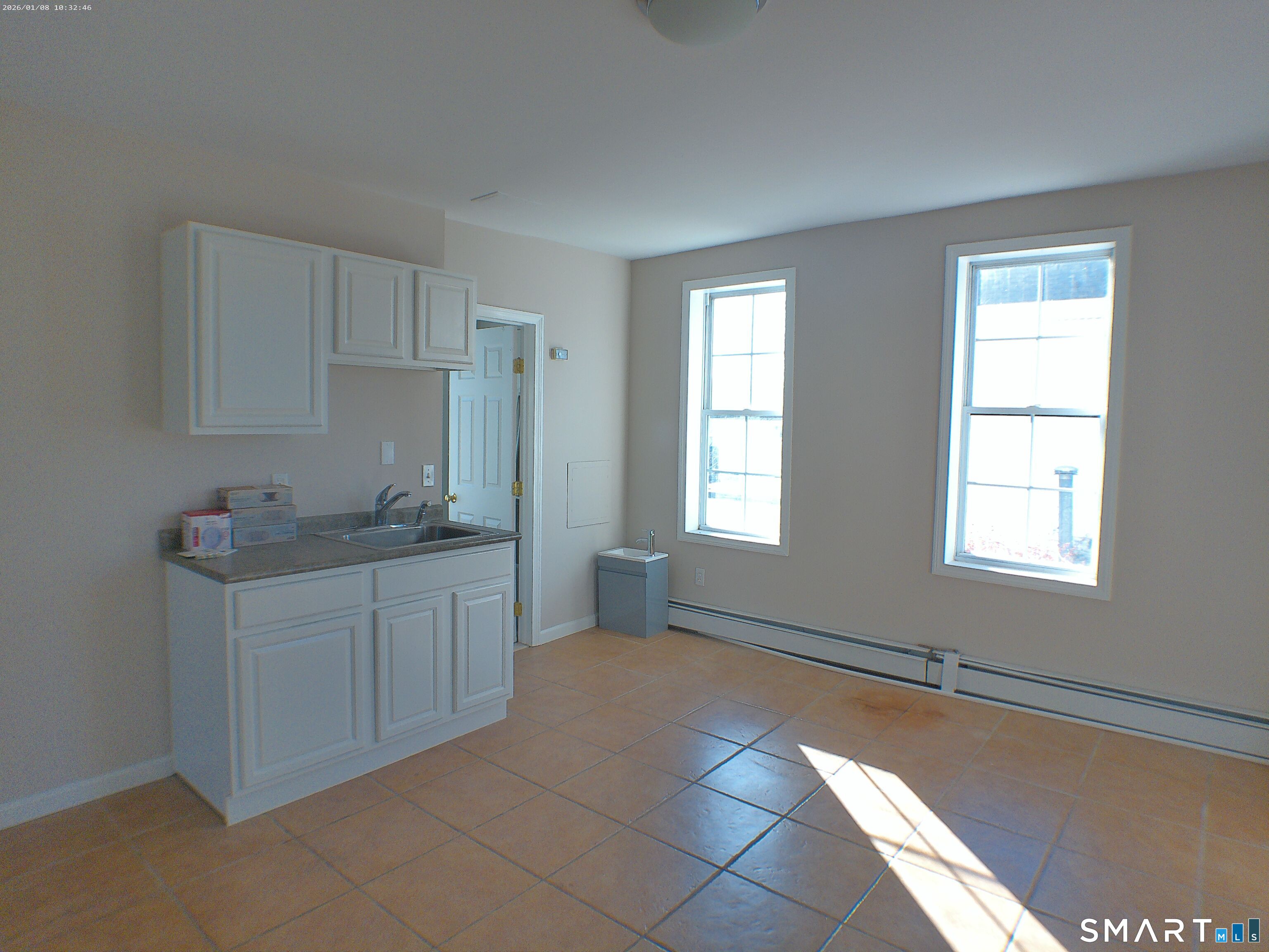 85 North Colony Street Wallingford, CT 06492 - Photo 14 of 35 a kitchen with granite countertop a sink and a stove top oven