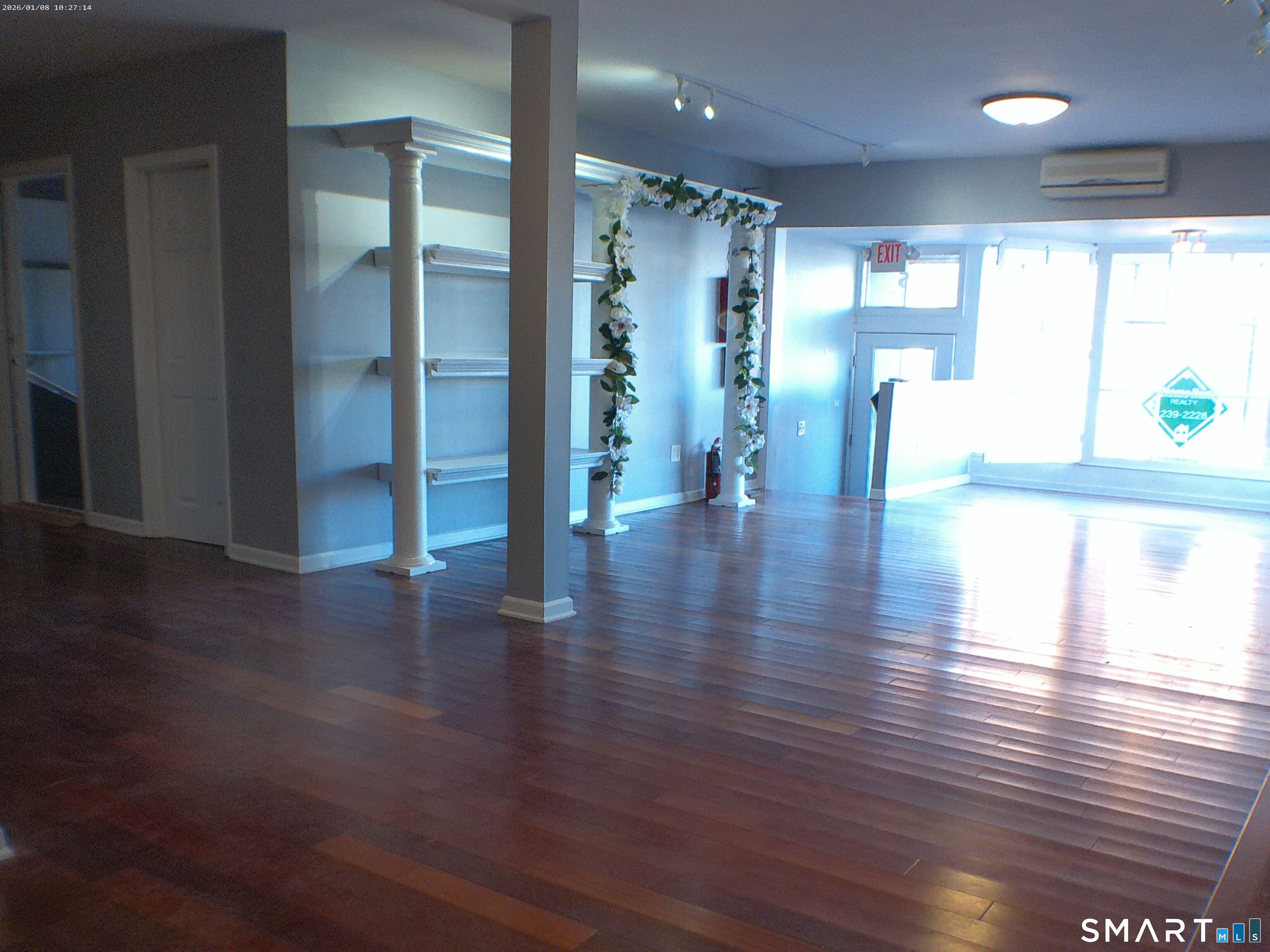 85 North Colony Street Wallingford, CT 06492 - Photo 2 of 35 a view of an empty room with wooden floor and a large window