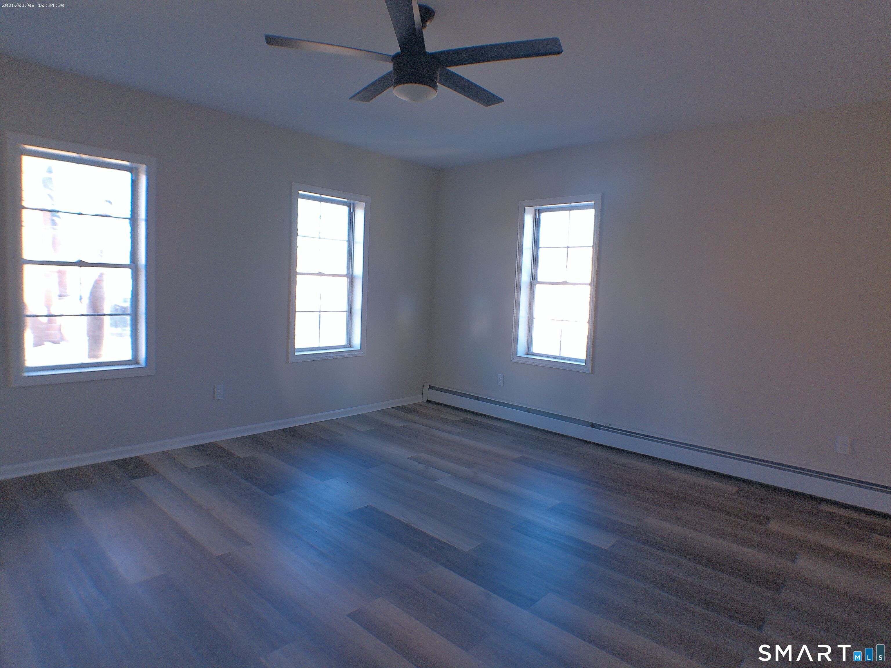 85 North Colony Street Wallingford, CT 06492 - Photo 21 of 35 a view of an empty room with wooden floor and window