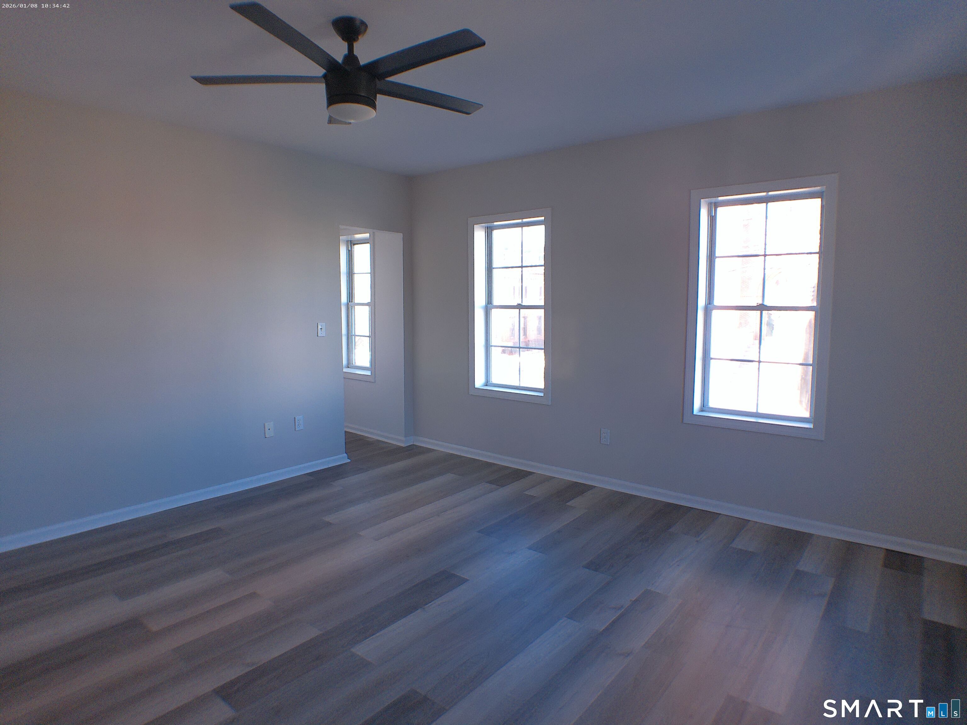 85 North Colony Street Wallingford, CT 06492 - Photo 22 of 35 a view of an empty room with wooden floor and a window