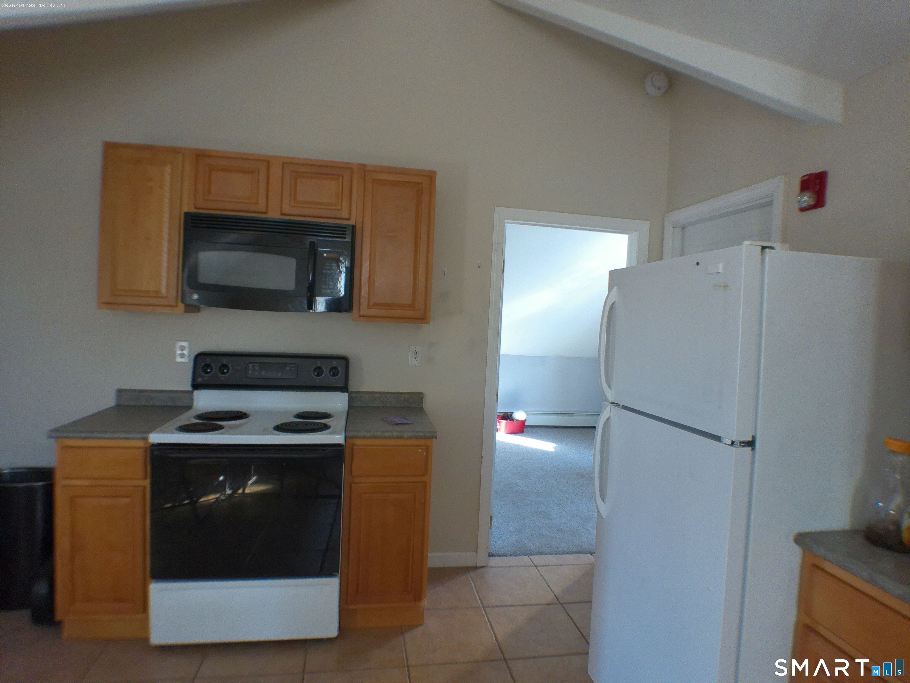 85 North Colony Street Wallingford, CT 06492 - Photo 28 of 35 a kitchen with a stove and a microwave
