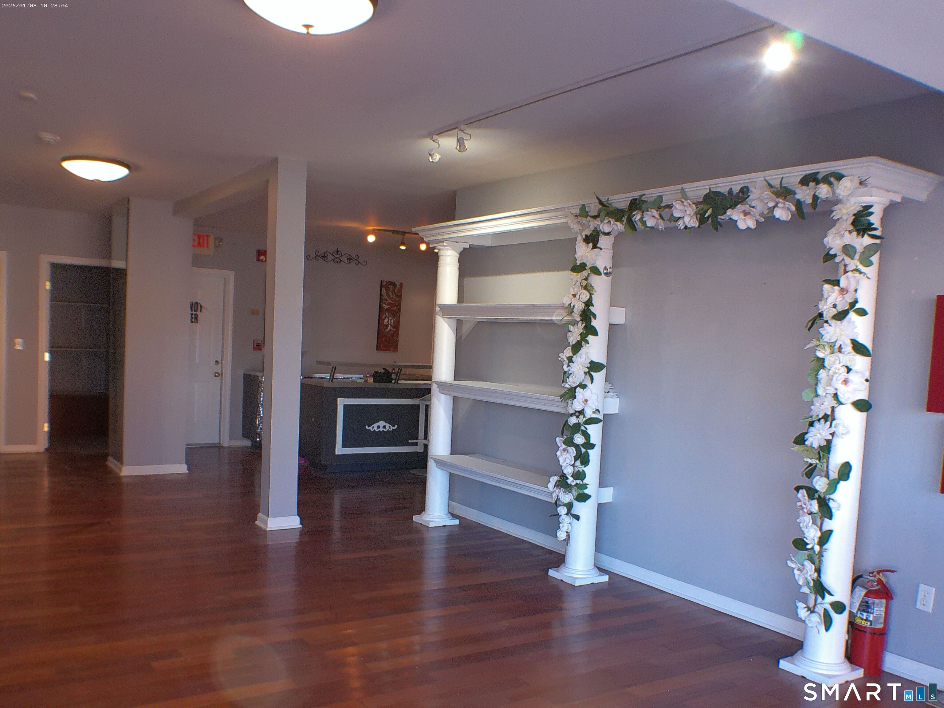 85 North Colony Street Wallingford, CT 06492 - Photo 4 of 35 a view of a hallway with wooden floor window and a kitchen