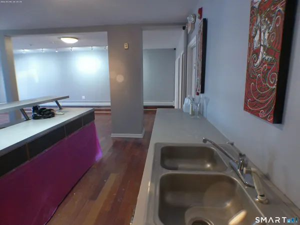 a kitchen with a sink and a stove