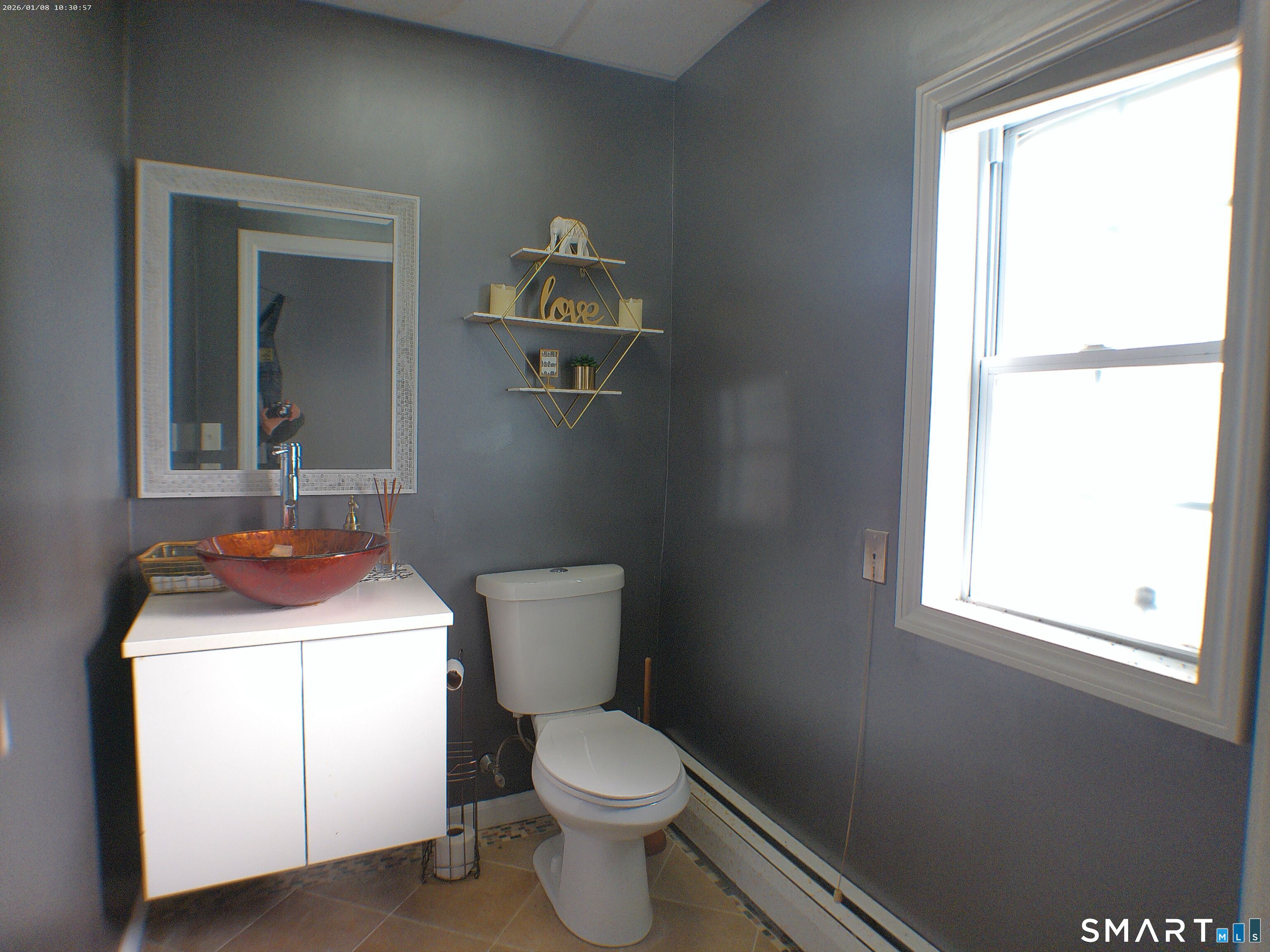 85 North Colony Street Wallingford, CT 06492 - Photo 8 of 35 a bathroom with a toilet sink and mirror