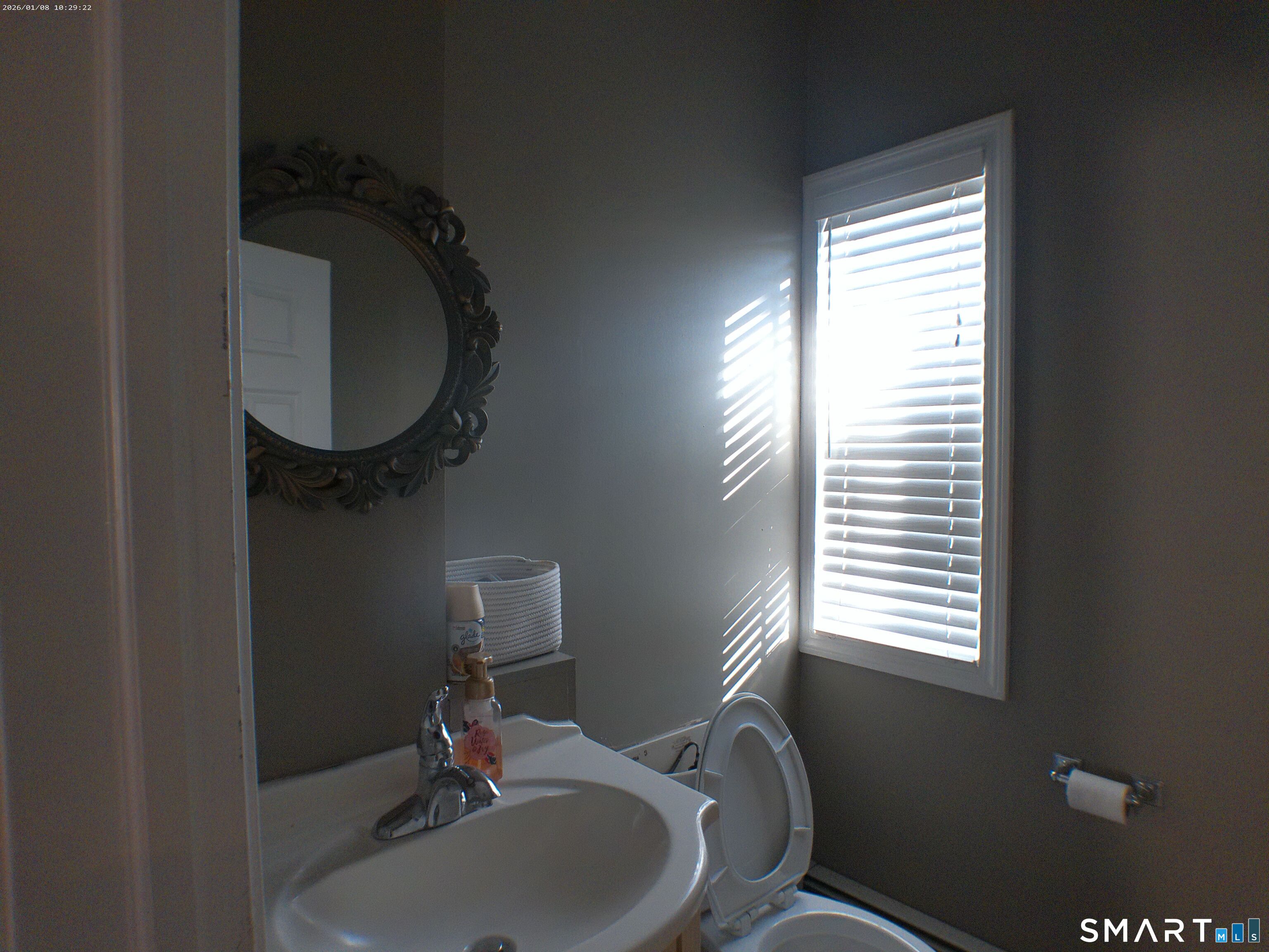 85 North Colony Street Wallingford, CT 06492 - Photo 8 of 35 a bathroom with a sink toilet and a mirror