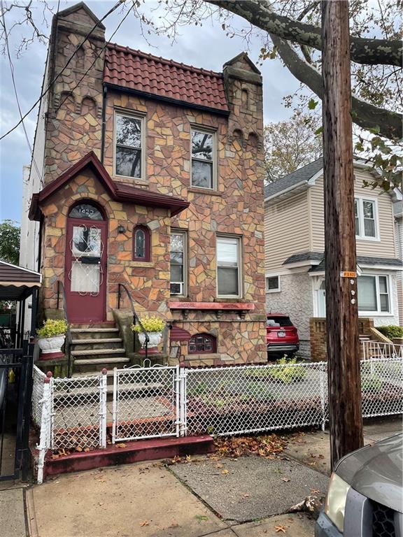 a front view of a building with parking space