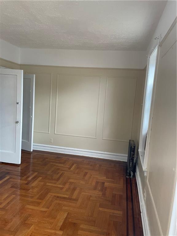1423 Schenectady Avenue Brooklyn, NY 11203 - Photo 14 of 45 a view of room with window and wooden floor
