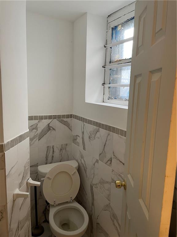 1423 Schenectady Avenue Brooklyn, NY 11203 - Photo 21 of 45 a bathroom with a toilet and a sink