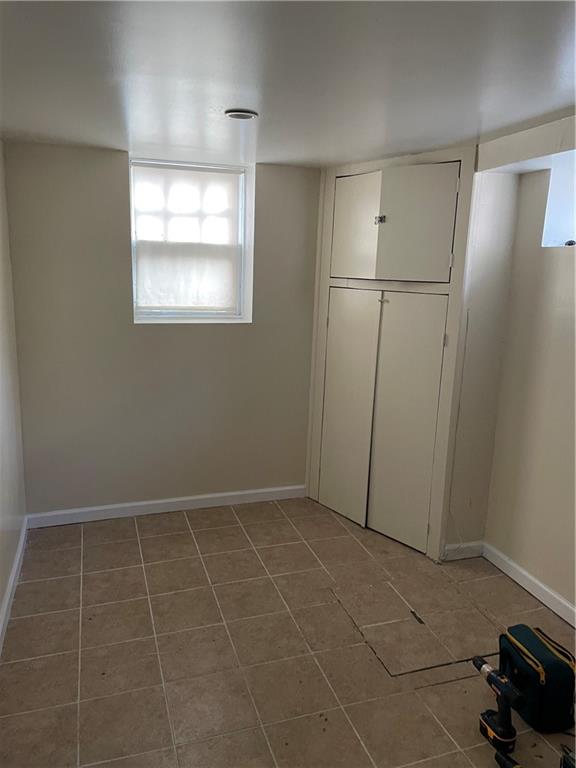 1423 Schenectady Avenue Brooklyn, NY 11203 - Photo 31 of 45 an empty room with windows