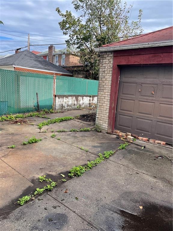 1423 Schenectady Avenue Brooklyn, NY 11203 - Photo 34 of 45 a view of a house with a garage
