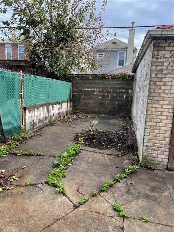 1423 Schenectady Avenue Brooklyn, NY 11203 - Photo 35 of 45 a front view of a house with a yard