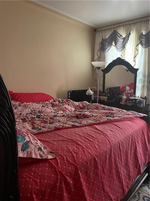 1423 Schenectady Avenue Brooklyn, NY 11203 - Photo 44 of 45 a bedroom with a bed and a window