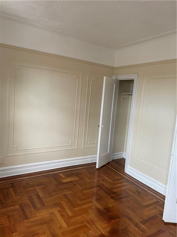 1423 Schenectady Avenue Brooklyn, NY 11203 - Photo 8 of 45 an empty room with wooden floor and window