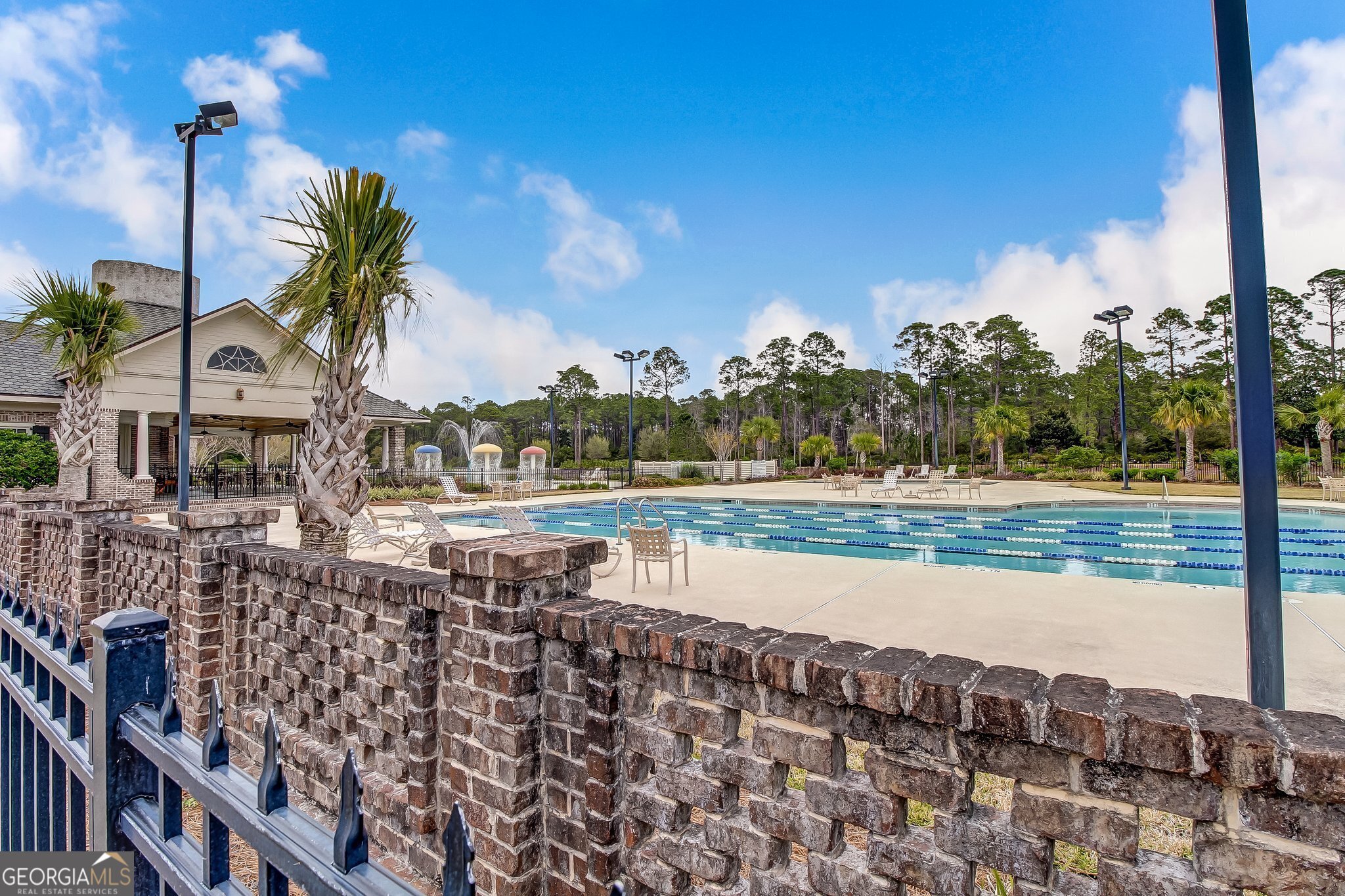 302 South Point Boulevard St. Marys, GA 31558 - Photo 15 of 18 a view of a swimming pool with a yard