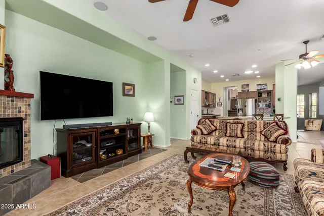 a kitchen with granite countertop a sink and a wooden floor