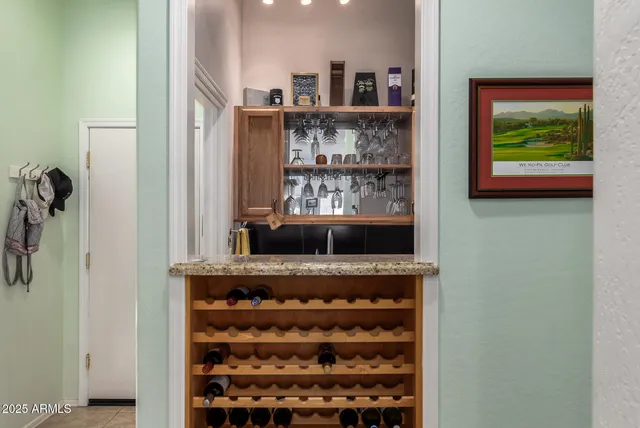 a bathroom with a tub a double vanity sink and a mirror