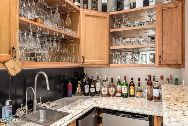 a bathroom with a tub a sink and a mirror